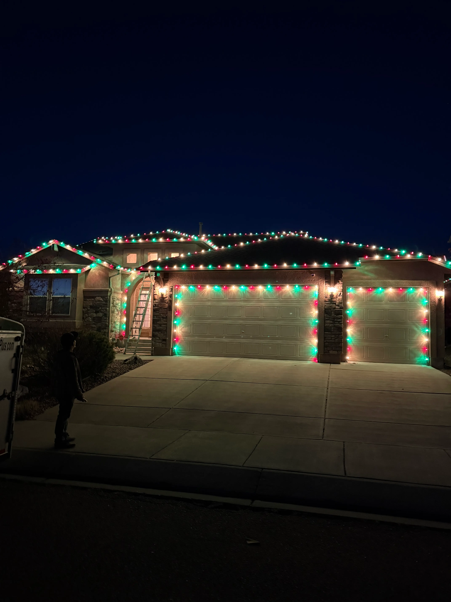 Red and green LED roofline with garage outline — Front Range portfolio install