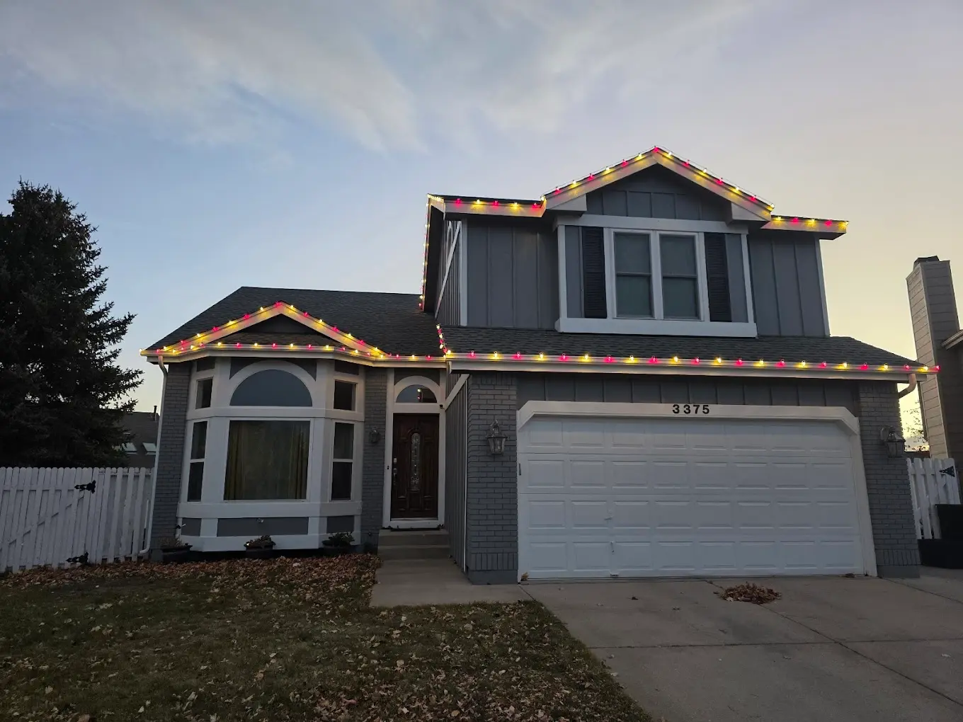 Two-story home with multicolor LED roofline — company portfolio photo